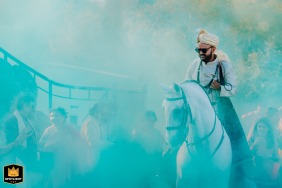 A joyful Baraat ceremony in Penha Longa, Sintra, Portugal, where the groom, unfamiliar with horse riding, is cheered on by his guests in a vibrant procession towards his bride.